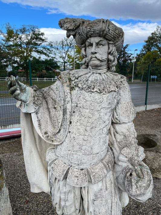 Deux Statues de jardin en pierre reconstituée représentant une scène de commerce